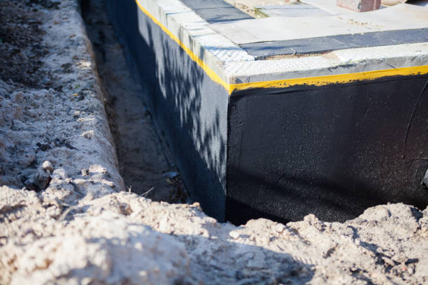 Professional Waterproofing technician working in Darien Center, NY